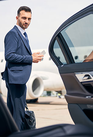 Executive chauffeur service with luxury vehicle at airport