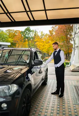 Luxury black SUV and professional chauffeur for funeral transportation in Palos Verdes Estates.