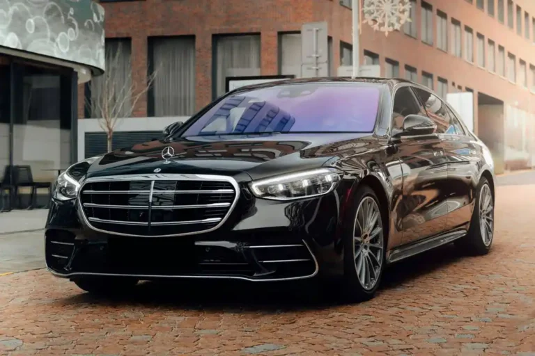 A black Mercedes-Benz luxury vehicle parked for a professional chauffeur pickup, providing premium transportation from Pomona to and from LAX.