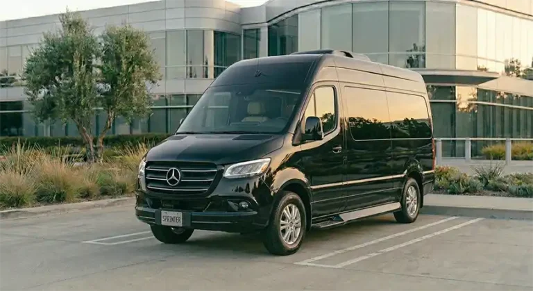 Black Mercedes-Benz Sprinter from the Apollo executive fleet parked outside a corporate office.